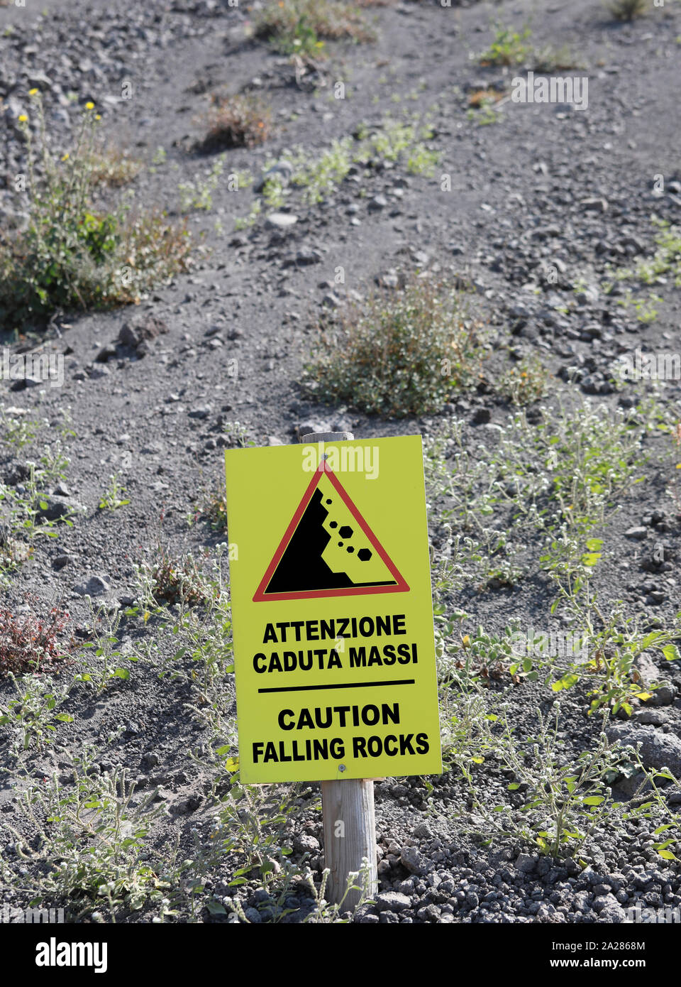Signal On The Slope Of Volcano With Text In English And Italian Language Caution Falling Rocks And Lava Stones Stock Photo Alamy