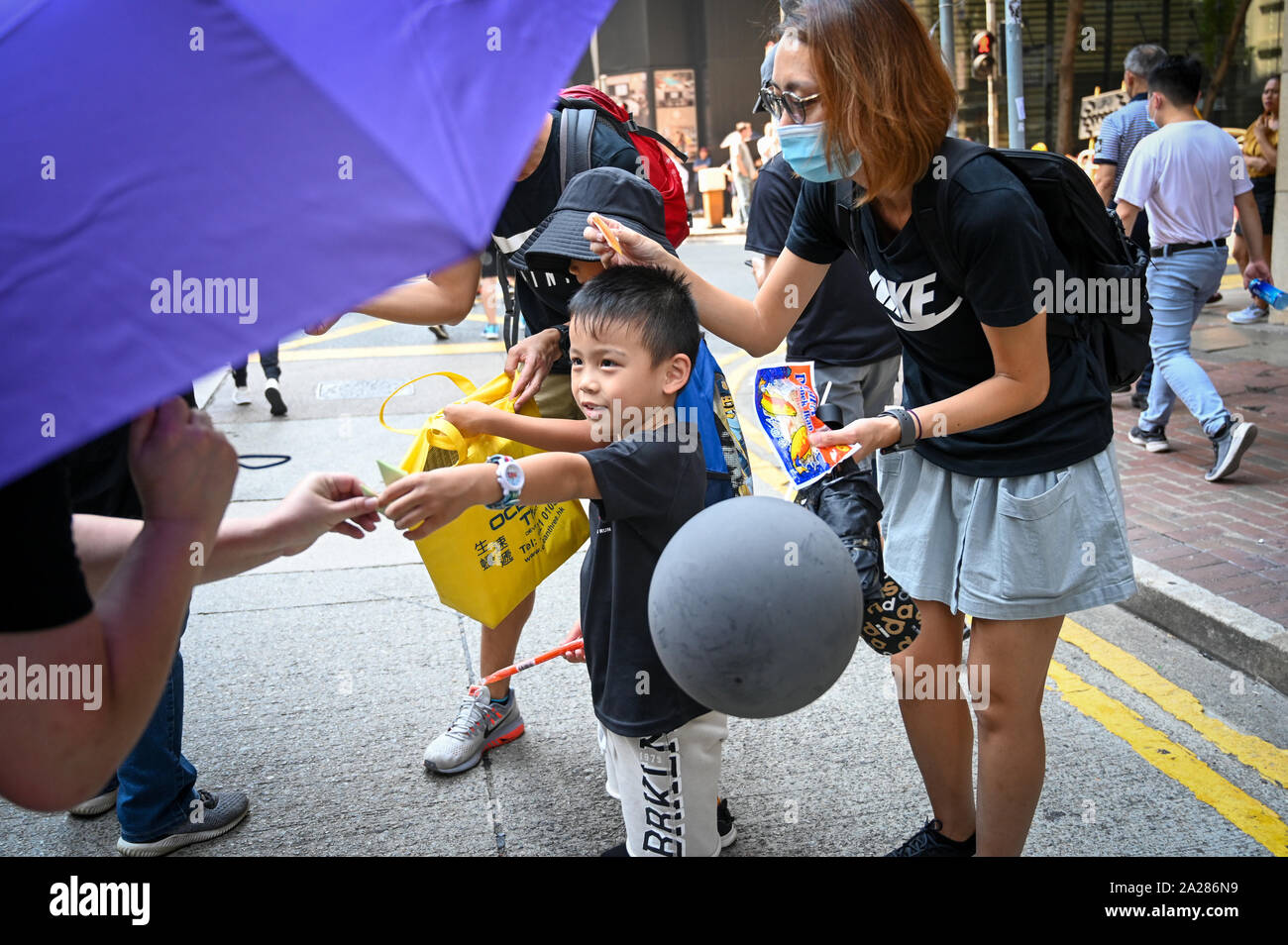 Hong Kong, Hong Kong Sar. 01st Oct, 2019. A family hands out folded paper doves, a symbol of peace, during a protest rally in Hong Kong on October 1, 2019. Photo by Thomas Maresca/UPI Credit: UPI/Alamy Live News Stock Photo