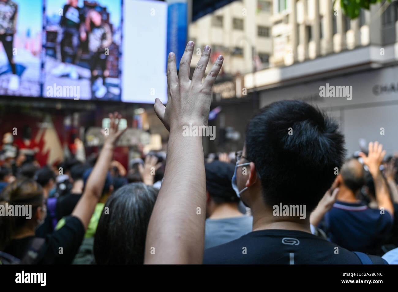 Hong Kong, Hong Kong Sar. 01st Oct, 2019. A demonstrator holds up five fingers, signifying the five demands of Hong Kong's protest movement, on October 1, 2019 in Hong Kong. Photo by Thomas Maresca/UPI Credit: UPI/Alamy Live News Stock Photo