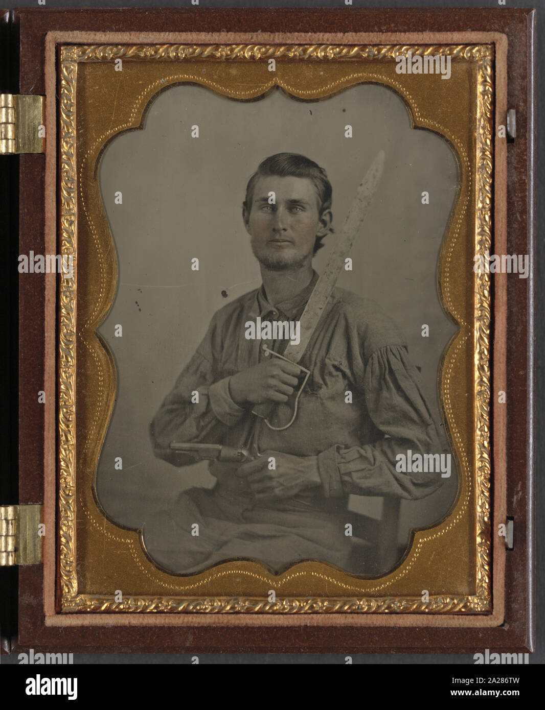 Private Simeon J. Crews of Co. F, 7th Texas Cavalry Regiment, with cut down saber and revolver Stock Photo