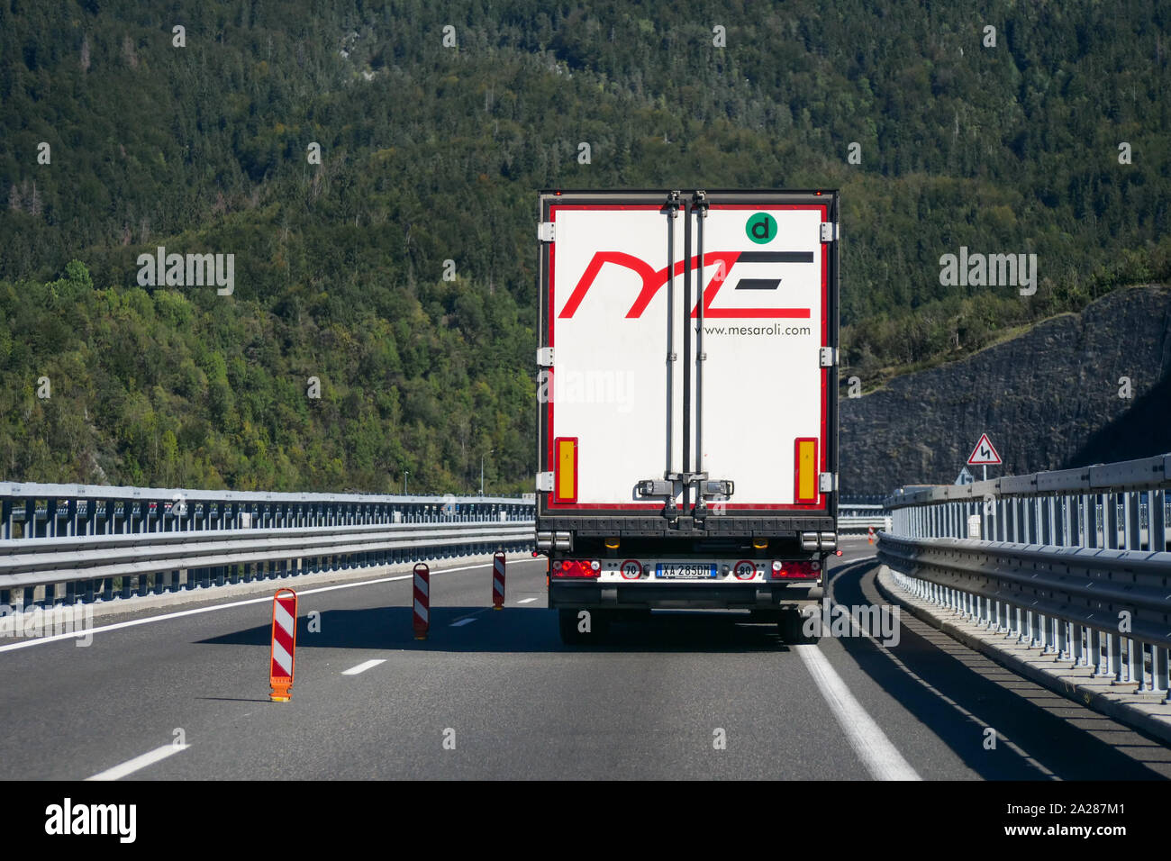 Trucks drive on the Egratz viaduct, Chamonix-Mont-Blanc valley, Haute-Savoie, France Stock Photo