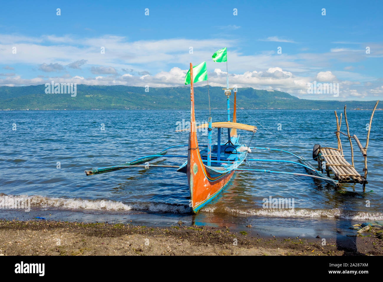 Traditional Bangka boat docked on on the shore of Taal Lake on Taal Volcano Island, Talisay, Batangas Province, Philippines Stock Photo