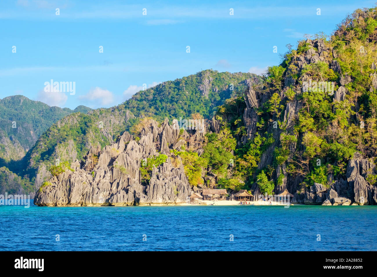 Small native village of thatched huts on the coast of Coron Island, Coron, Palawan, Philippines Stock Photo