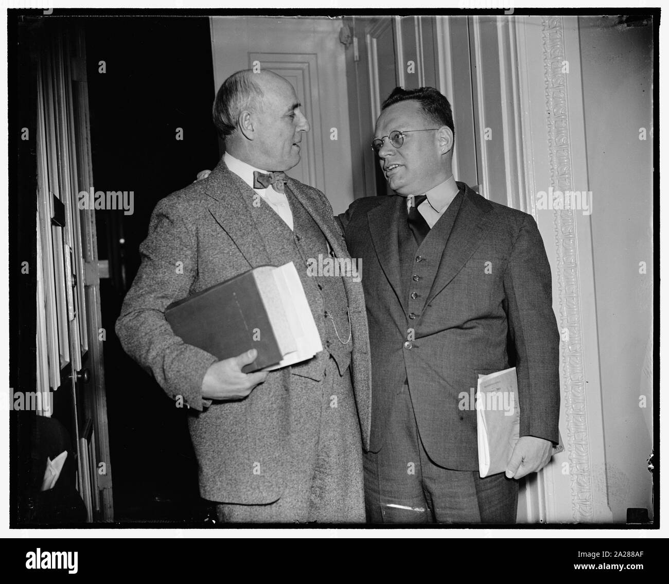 Pro and con. Washington, D.C., March 28. Fiery Rep. Maury Maverick (right) of Texas, today started a House revolt against Senate Majority Leader Barkley's resolution for an investigation of the Tennessee Valley Authority. He declared the Senate resolution is the foundation for a purge trial to get rid of Dr. Arthur E. Morgan, deposed Chairman of the T.W.A. Rep. Andrew J. May, (left) Democrat of Kentucky, is warmly supporting the resolution for an investigation, 3/28/38 Stock Photo