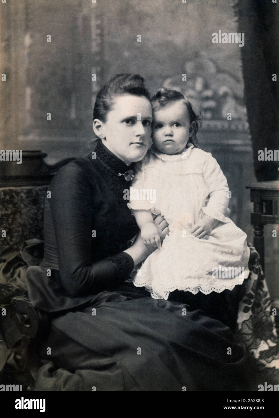 Archival photo of a mother and her daughter, circa 188s, USA. Stock Photo