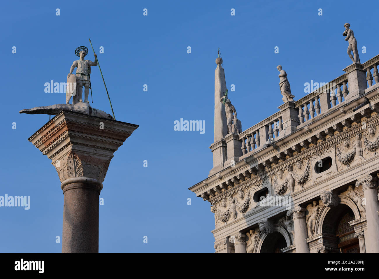 Granite column in the Piazzetta di San Marco, bearing the warrior-saint Theodore, who was the patron of the city before St Mark, Venice, Italy, Europe. Stock Photo