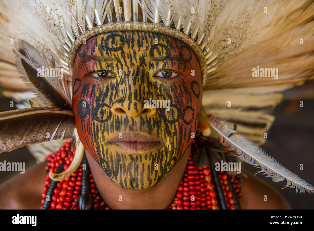 Indigenous with face painting and traditional clothes Stock Photo