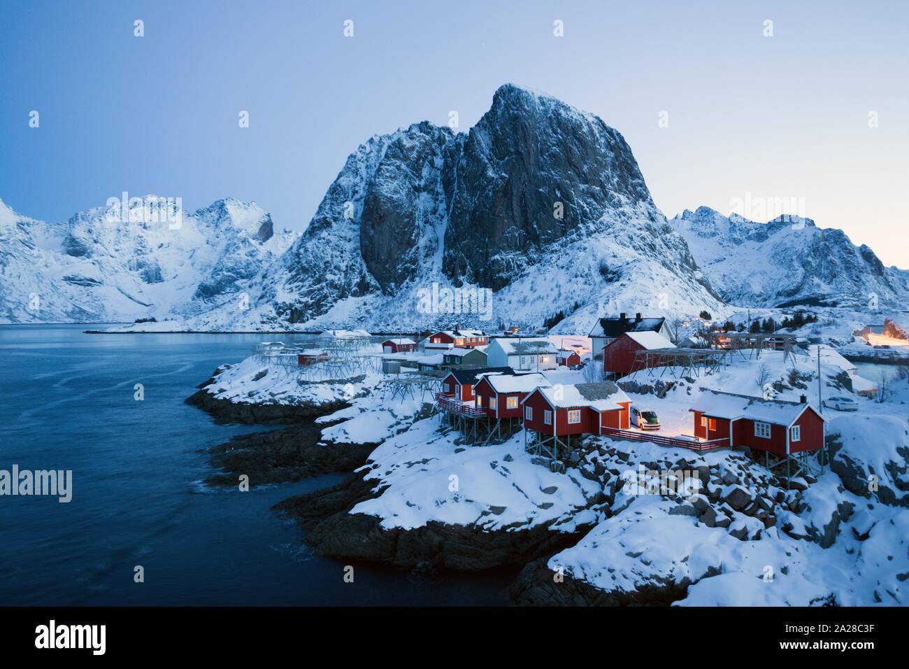 traditional norwegian red wooden house rorbu to stand on the shore of