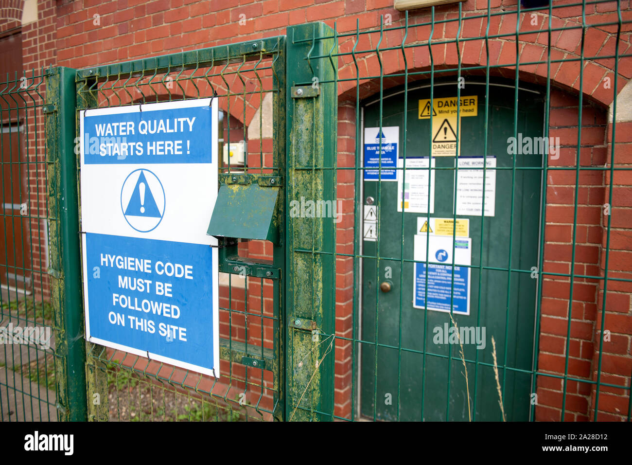 Health and safety notices on a water pumping station Stock Photo