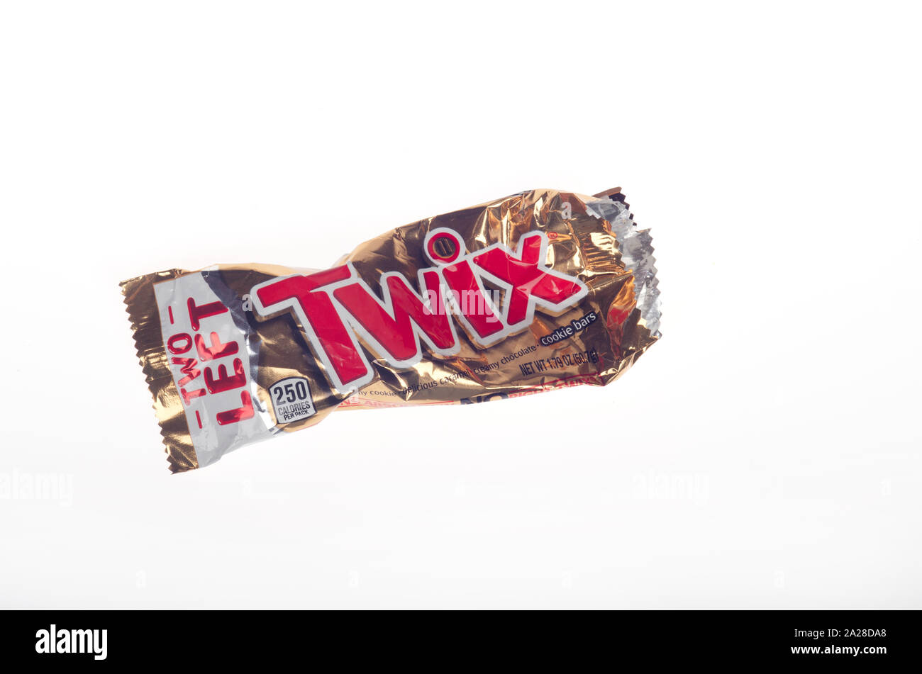 Empty crushed Twix candy bar wrapper on white Stock Photo