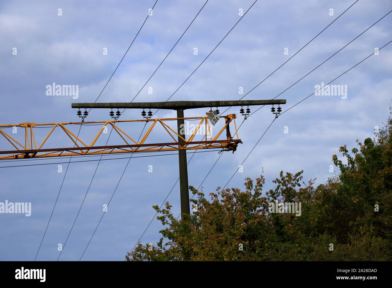 Crane moves at safety distance under a power line Stock Photo Alamy