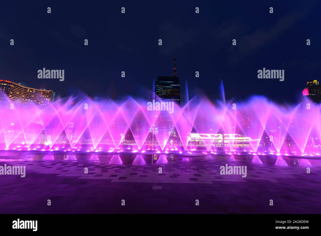 the fountain showing with lighting in night time Stock Photo - Alamy