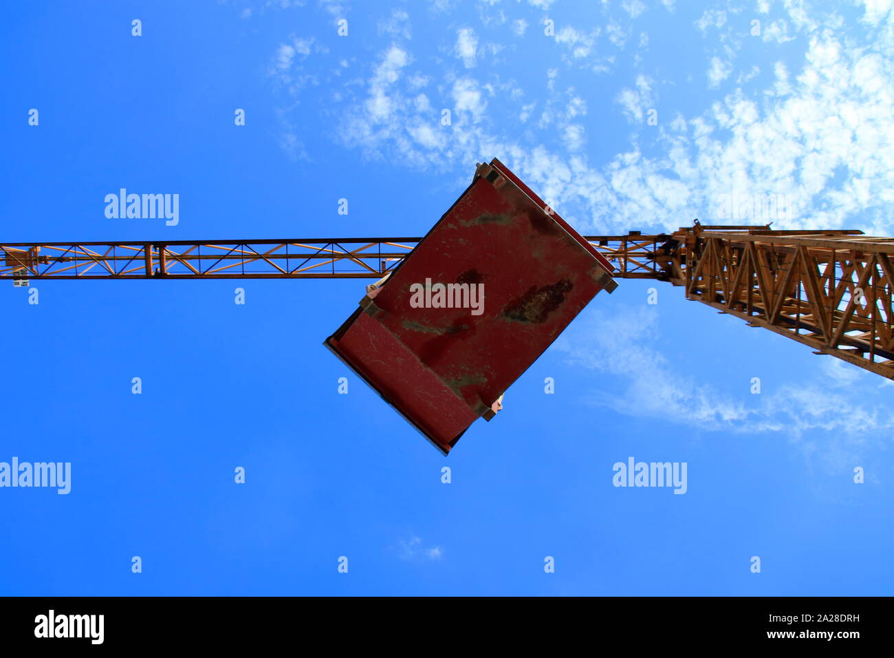 flying load under a construction crane Stock Photo - Alamy