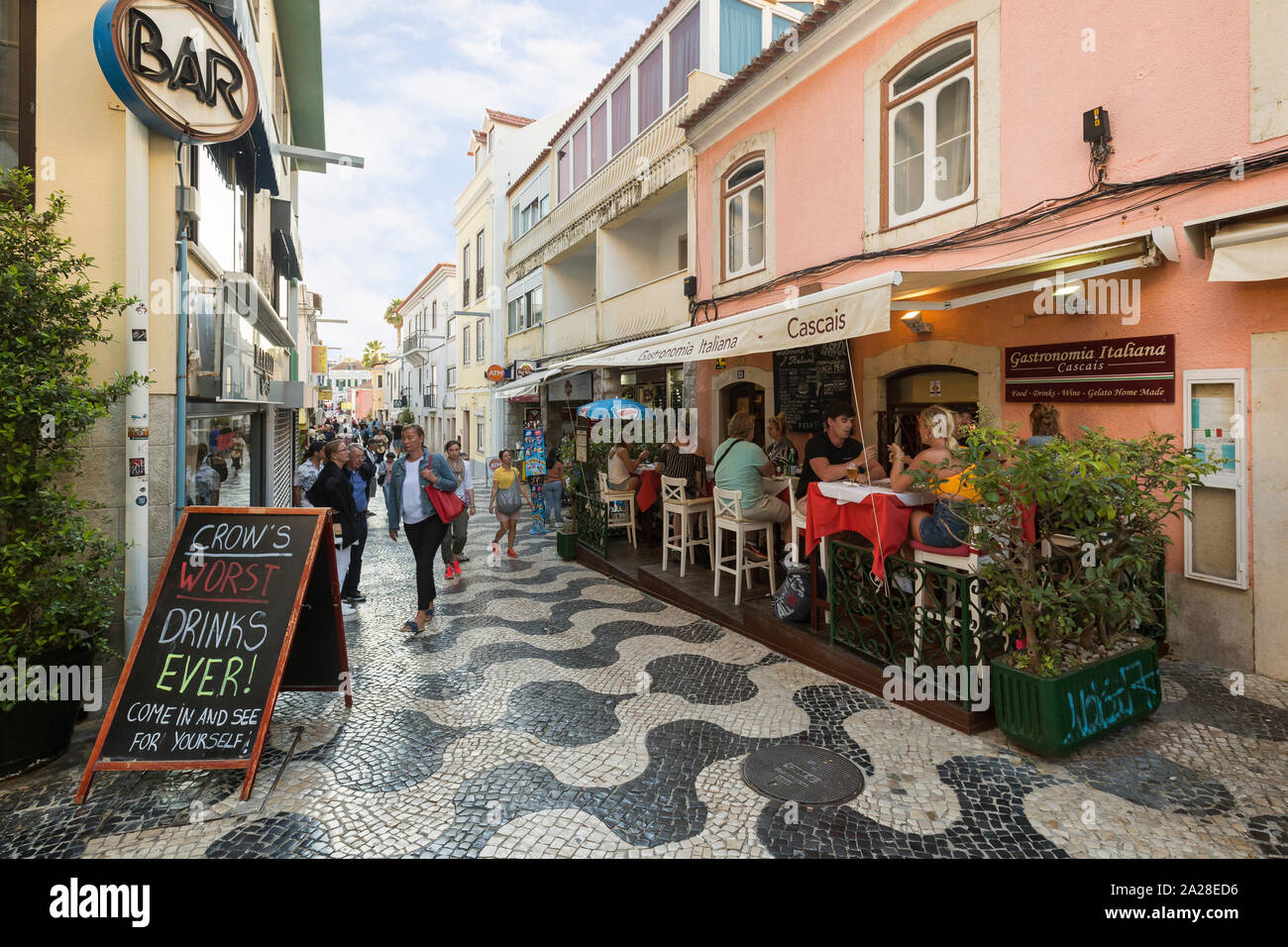 Tourists dining and walking at Rua Frederico Arouca, a pedestrian street, in the historic center of Cascais in Portugal, in the summer. Stock Photo
