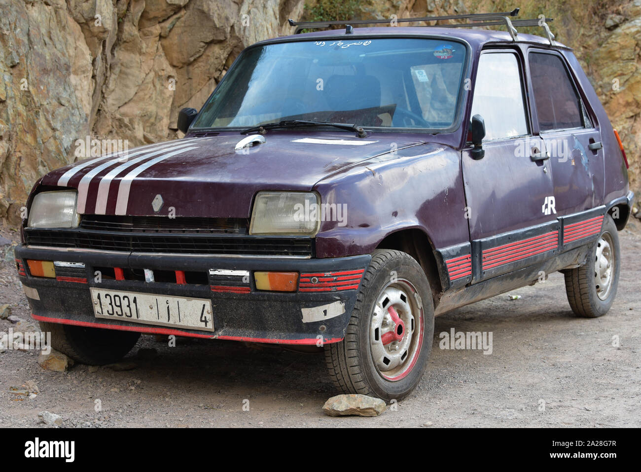 Old Renault 5 parked on a roadside in the ancient town of Imlil, High Atlas, Morocco, North Africa. Stock Photo
