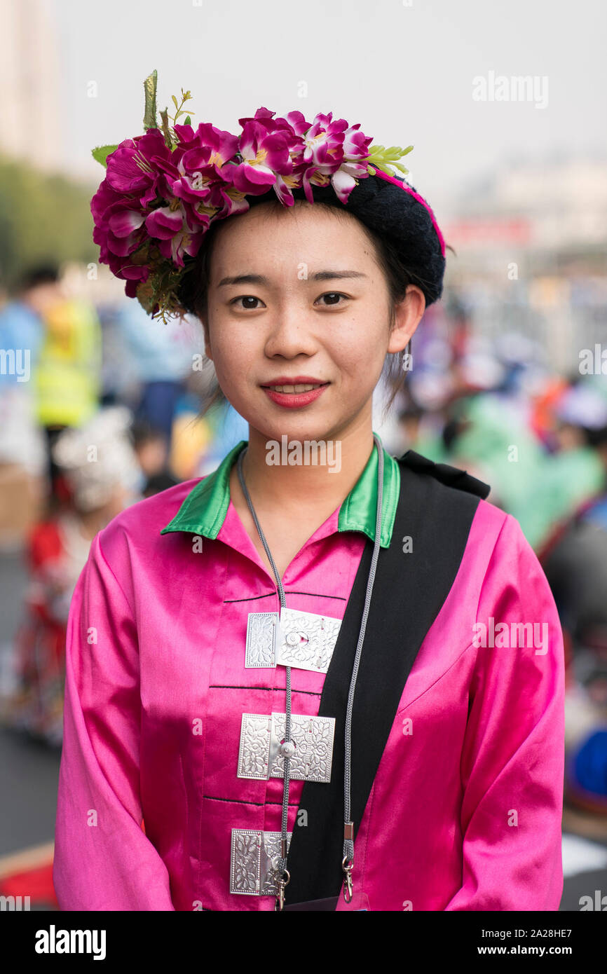 Beijing, China. 1st Oct, 2019. Yang Lixue of the Achang ethnic group poses for a photo before marching in a mass pageantry celebrating the 70th founding anniversary of the People's Republic of China (PRC) in Beijing, capital of China, Oct. 1, 2019. Credit: Zhang Haofu/Xinhua/Alamy Live News Stock Photo