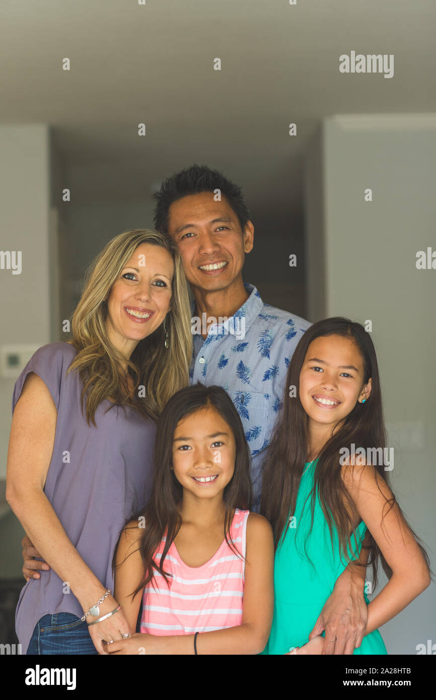 Portrait of a happy mixed race family. Stock Photo