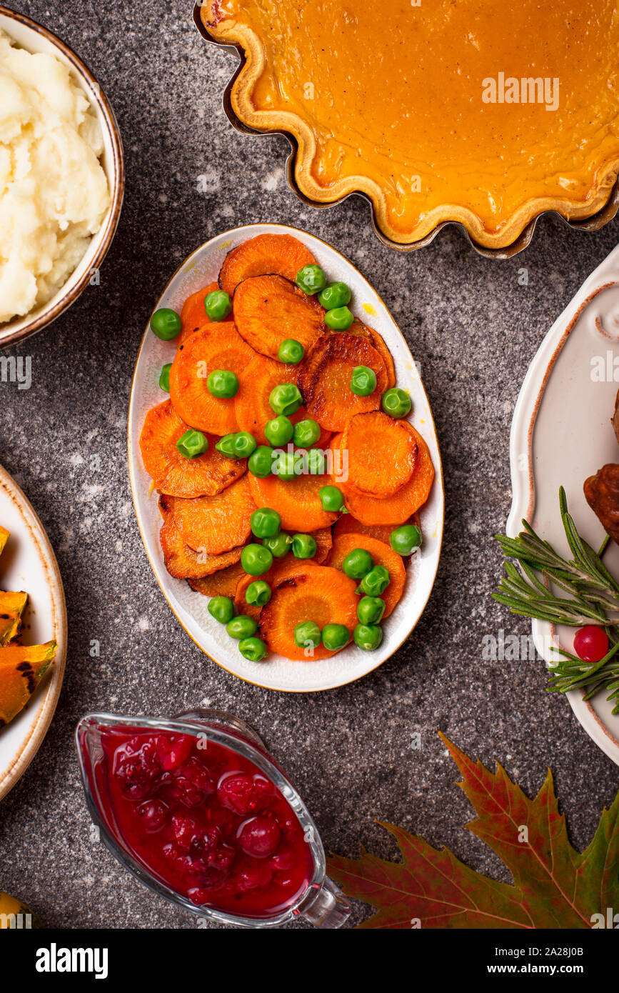 Glazed roasted carrot with peas Stock Photo Alamy