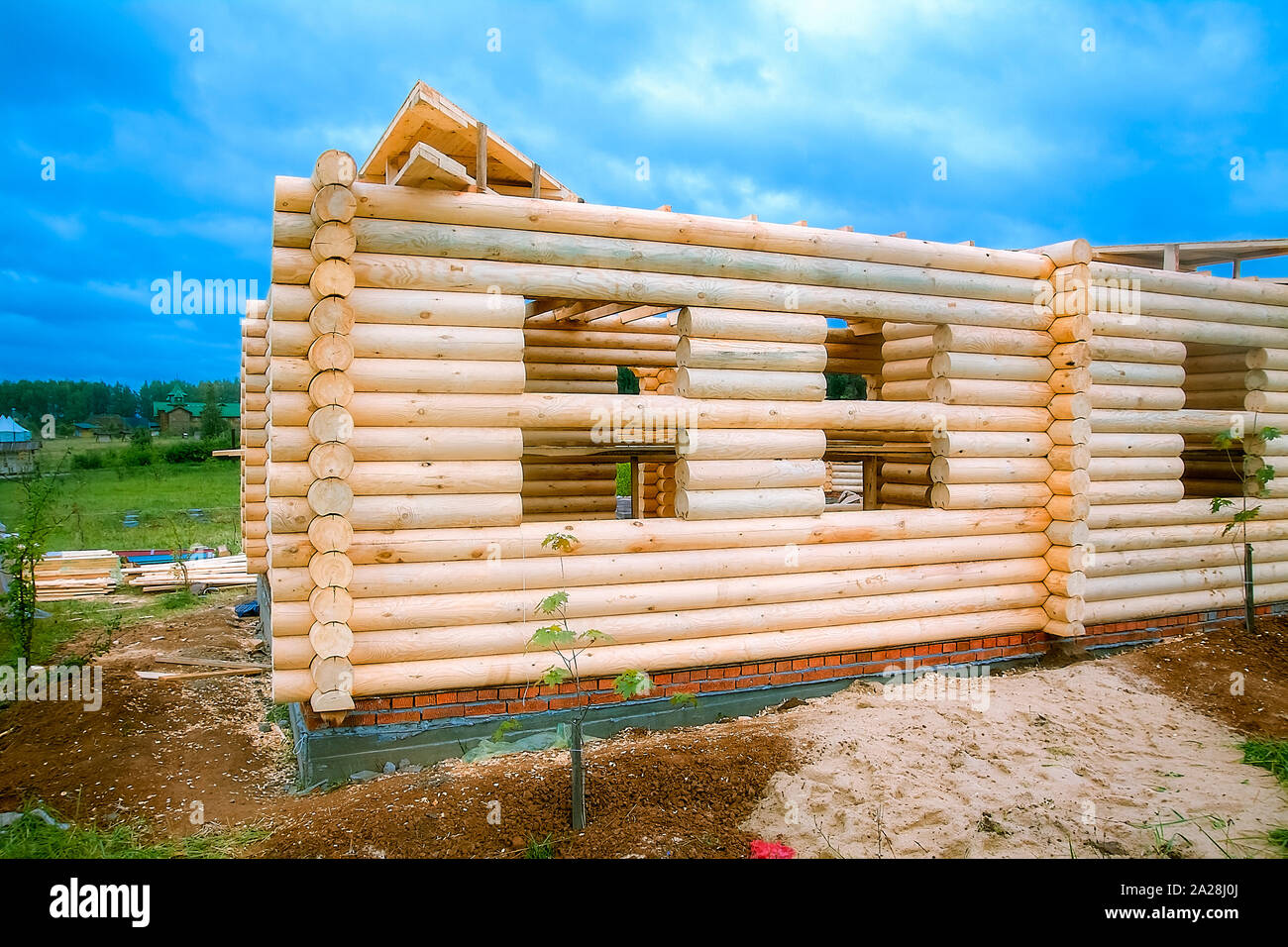The corner of a newly built wooden house. Stock Photo