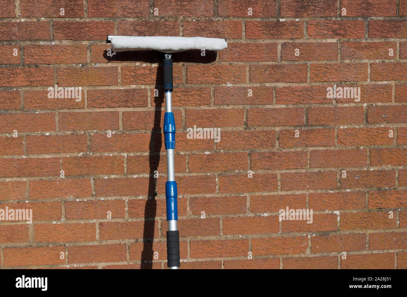 Water Fed Telescopic Window Cleaning Washing Pole, UK Stock Photo