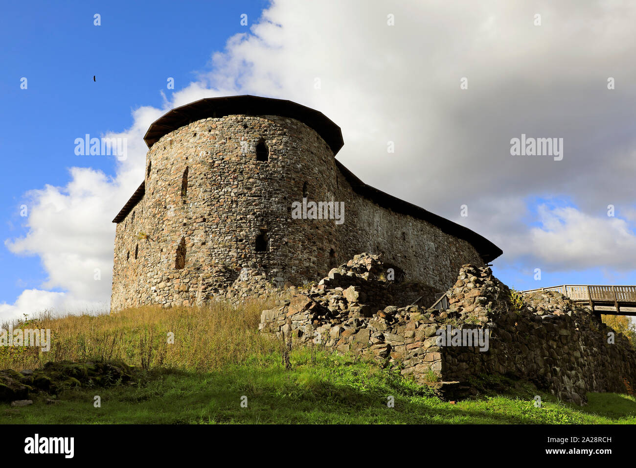 Medieval Raseborg Castle Ruins on a rock. Raseborg Castle was built in 1370s on a rock that was surrounded by water at the time. Against  the sky is s Stock Photo