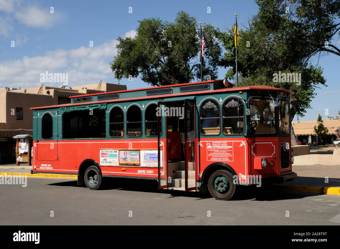 Historic trolley bus tours are a popular visitor attraction in Taos New Mexico. The tours operate twice a day during the summer season and last 3 hour Stock Photo