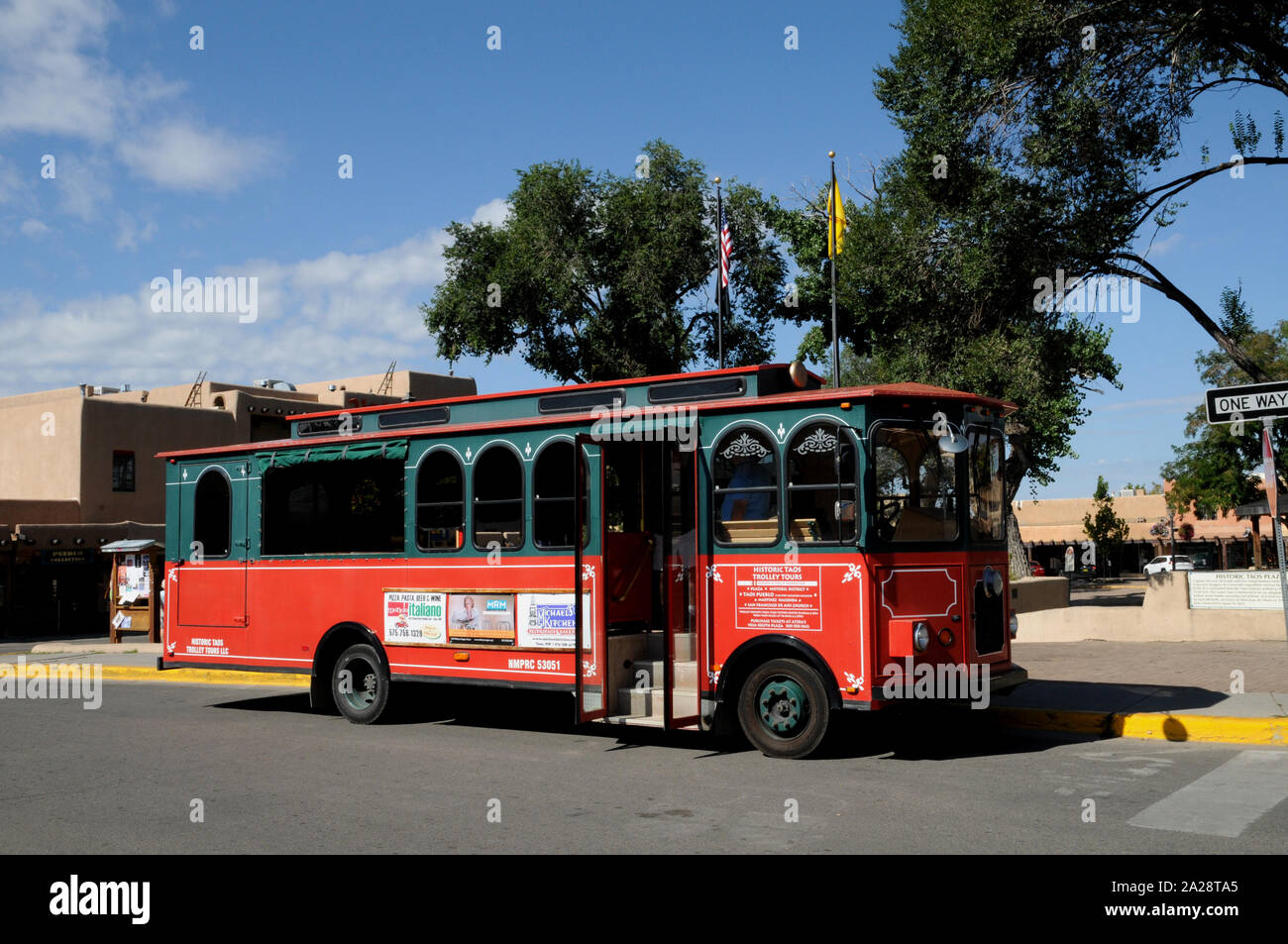 Historic trolley bus tours are a popular visitor attraction in Taos New Mexico. The tours operate twice a day during the summer season and last 3 hour Stock Photo