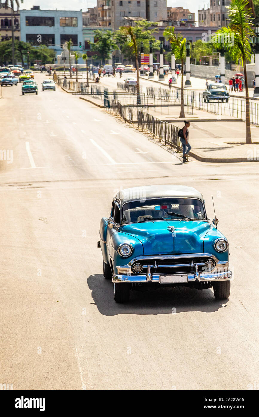 Old vintage blue retro car on the road in the center of Havana, Cuba Stock Photo