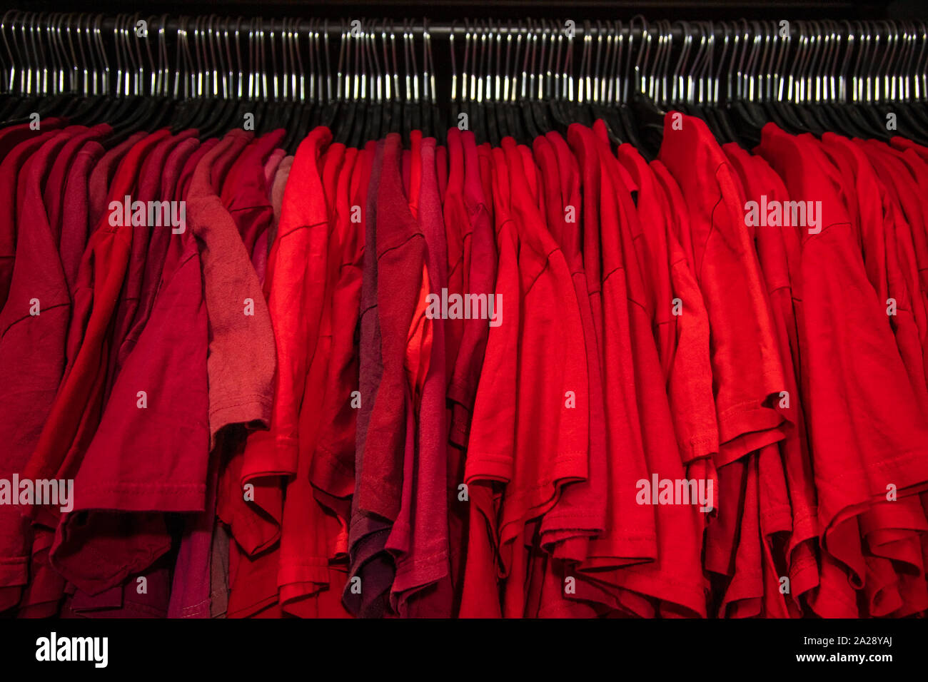 red-t-shirts-on-hangers-on-a-shop-wardro