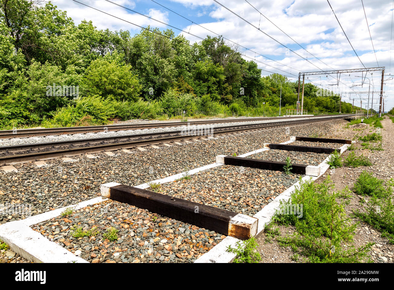 Double track electrified railway line in summer Stock Photo Alamy