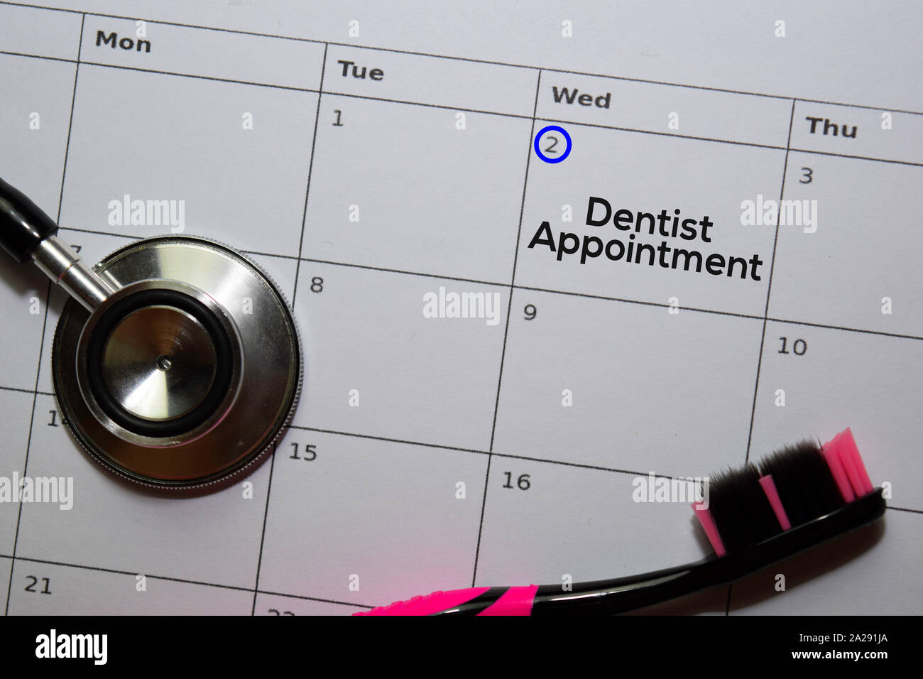Dentist Appointment text on white calendar background. Reminder or