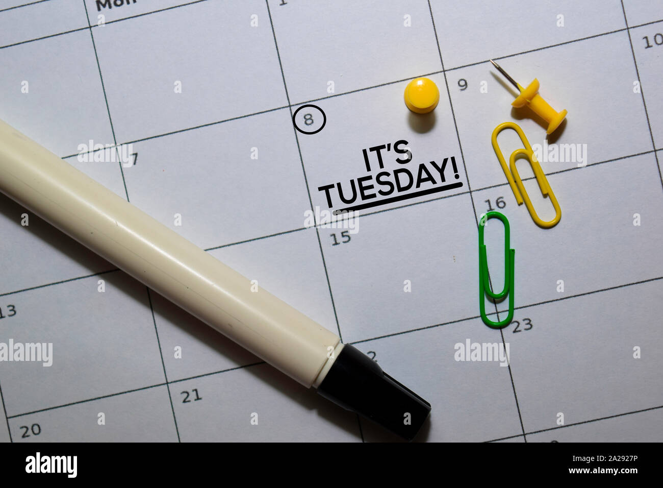 It's Tuesday text on white calendar background. Reminder or schedule ...
