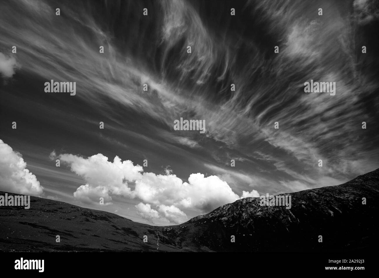 Cloud patterns in the sky at Coire Fhionn Lochan, Arran, West Coast of Scotland, UK Stock Photo