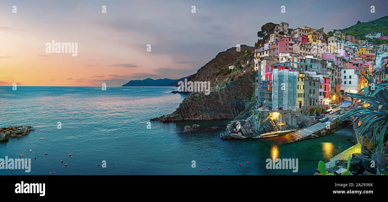 Panoramic view of Riomaggiore town in Cinque Terre National Park at night. Liguria, Italy Stock Photo