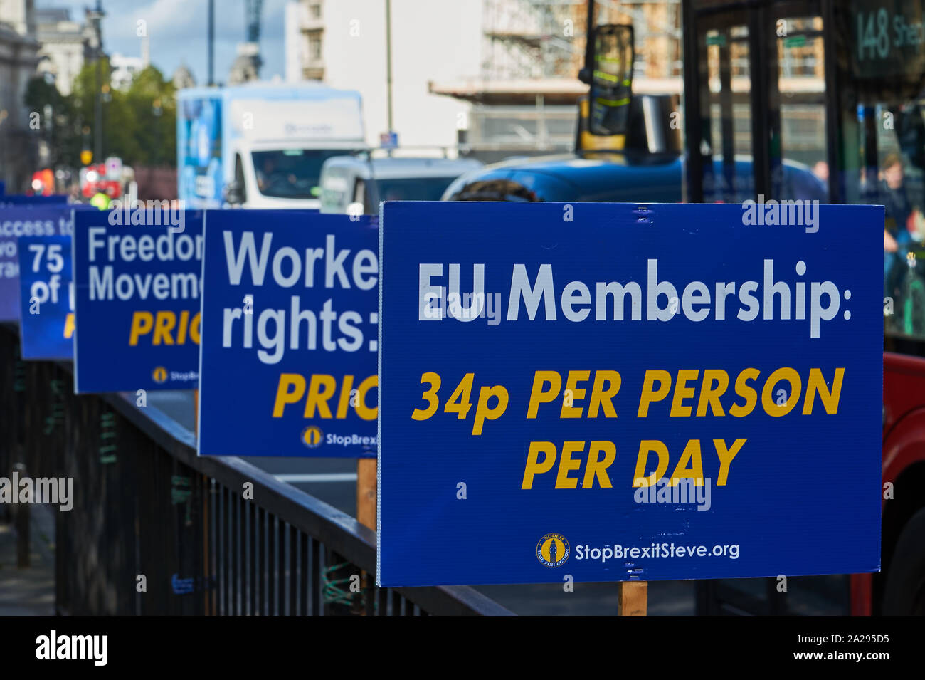 Placards supporting European membership fixed to railings outside the UK parliament buildings. Stock Photo