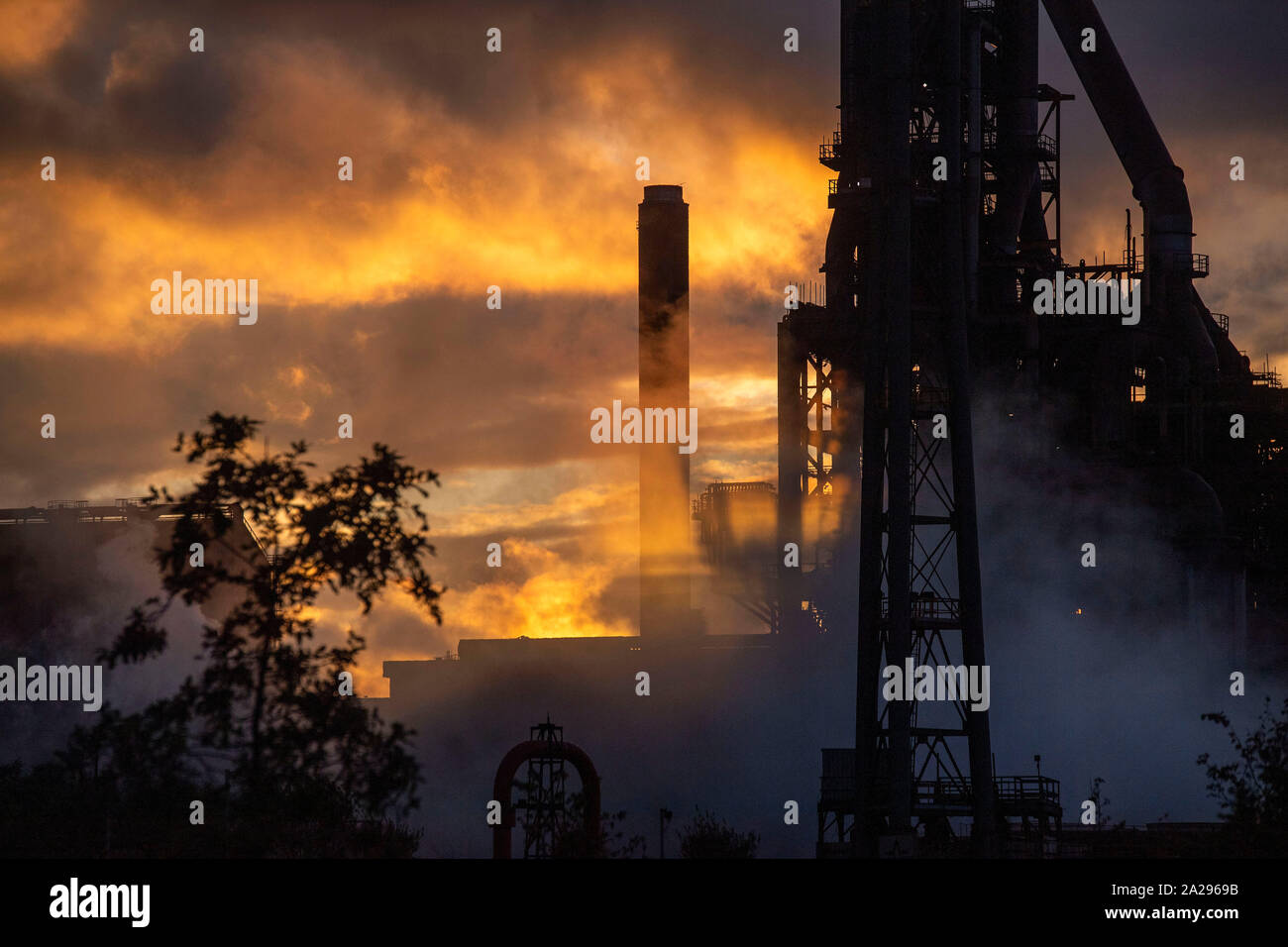 Port Talbot - UK - 1st October 2019 : The late evening sunshine bounces off the steam at the Tata Steelworks in Port Talbot this evening during a break in the wet weather. Credit: Phil Rees/Alamy Live News Stock Photo