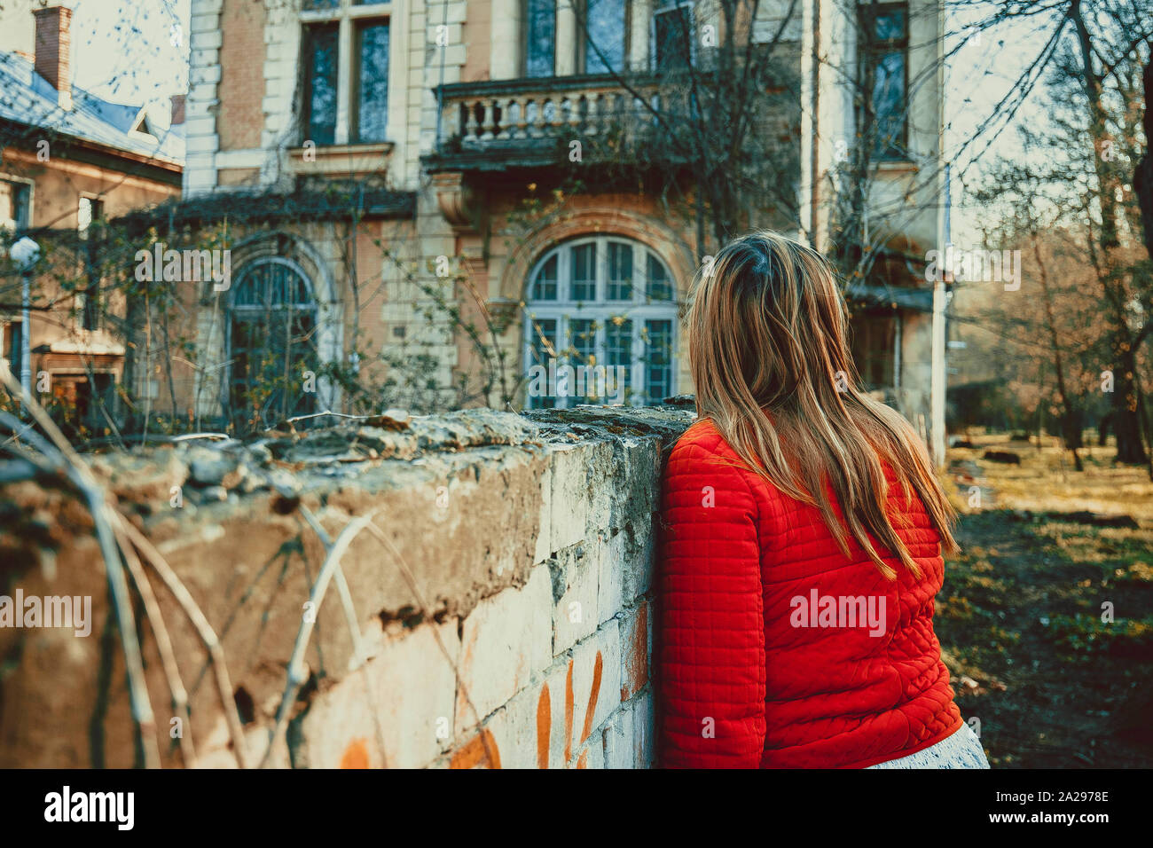 Girl in front of abandoned house, shot in Romanian city Stock Photo - Alamy