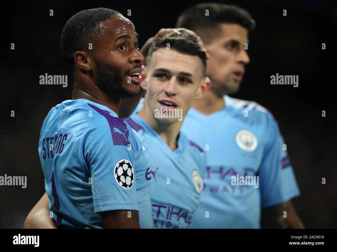 Manchester City's Phil Foden celebrates scoring his side's second goal of the game with Raheem Sterling during the UEFA Champions League match at the Etihad Stadium, Manchester. Stock Photo