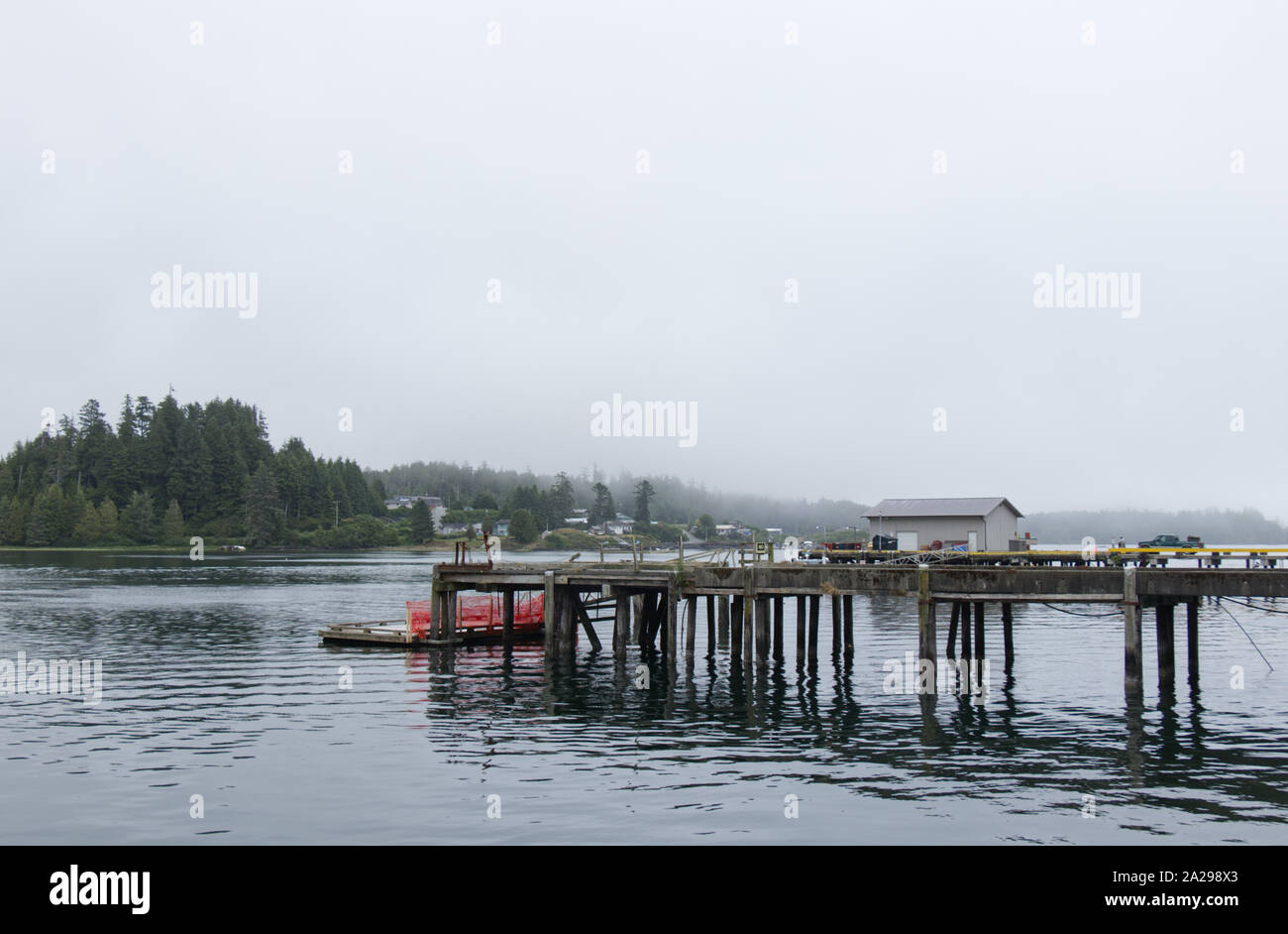 Small Dock for fishing boats in the middle of the Village at early morning Stock Photo