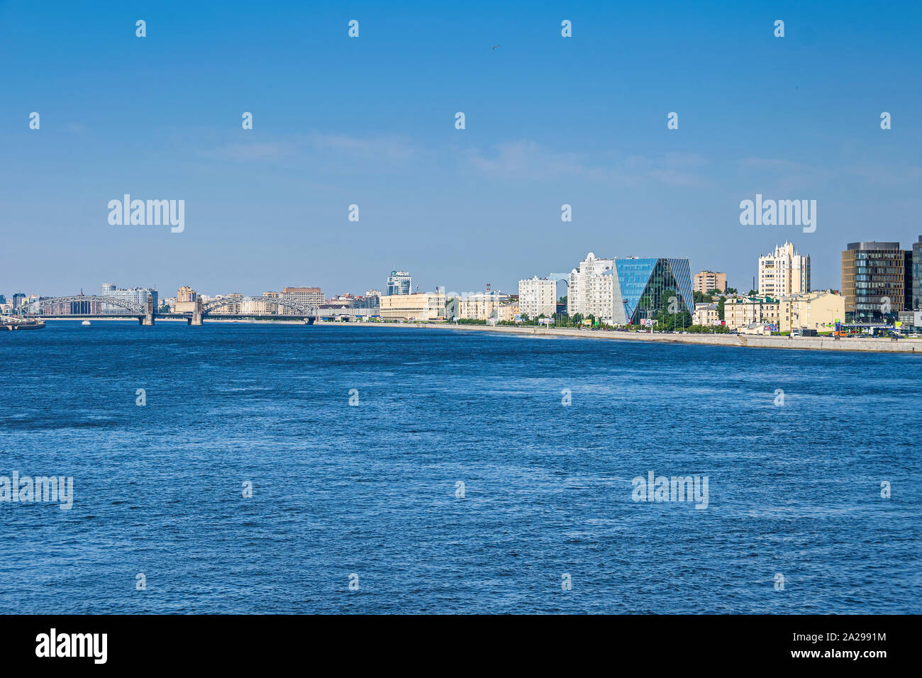 Saint Petersburg, Russia -  July 27, 2019: Malookhtinskaya Embankment of the Neva River with Bolsheokhtinsky Bridge or Okhtinsky Bridge Stock Photo