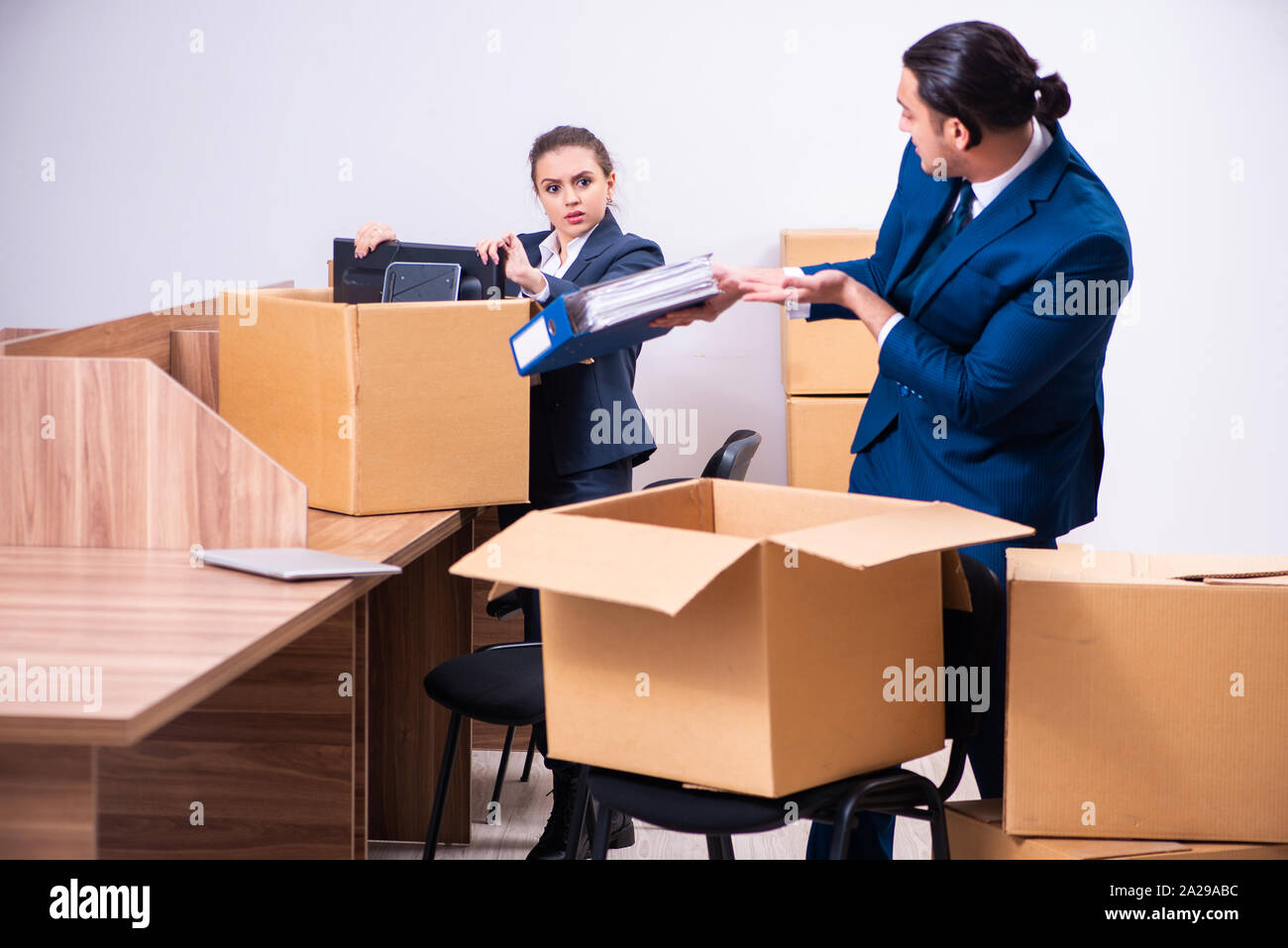 The two employees being fired from their work Stock Photo - Alamy