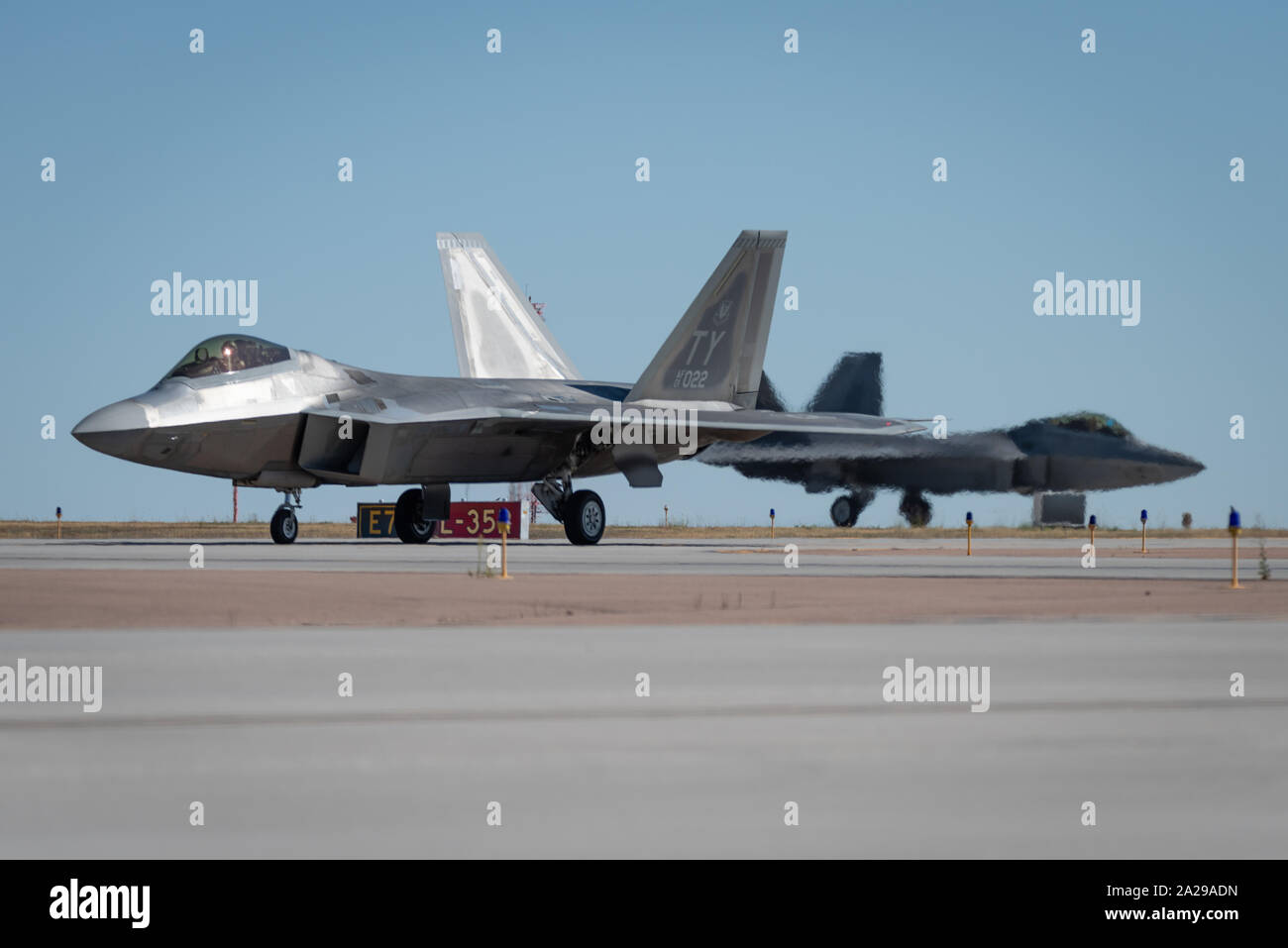 Two U.S. Air Force F-22 Raptors land in Colorado Springs, Colo. for the Pikes Peak Regional Air Show, Sep 19, 2019. Performing on behalf of Air Combat Command F-22 Demo Team, the 13-member team travels to 25 air shows a season to showcase the performance and capabilities of the world's premier 5th-generation fighter. (U.S. Air Force photo by 2nd Lt. Sam Eckholm) Stock Photo