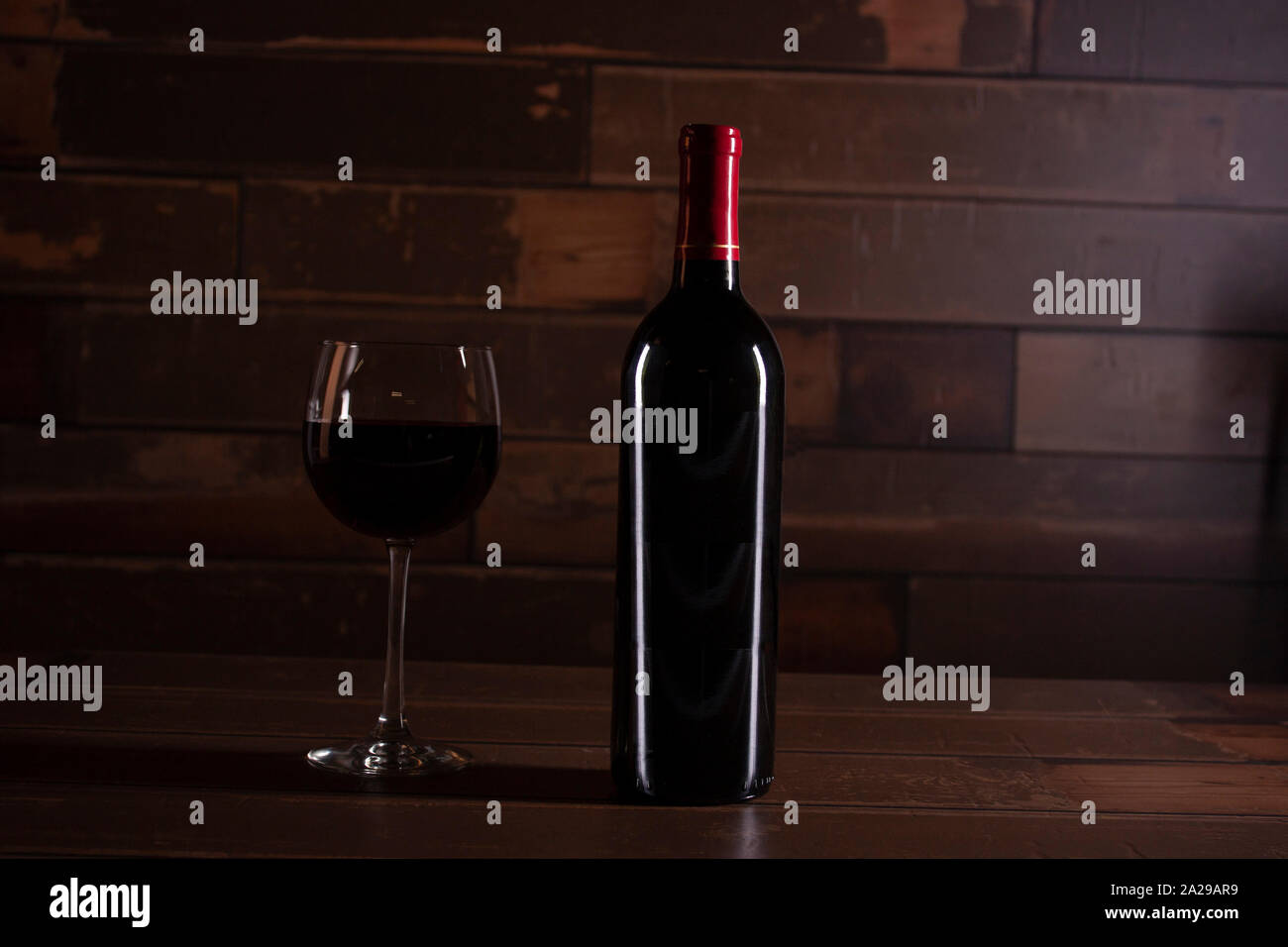 The luxury and sophistication of red wine applying its charm for a romantic dinner Stock Photo