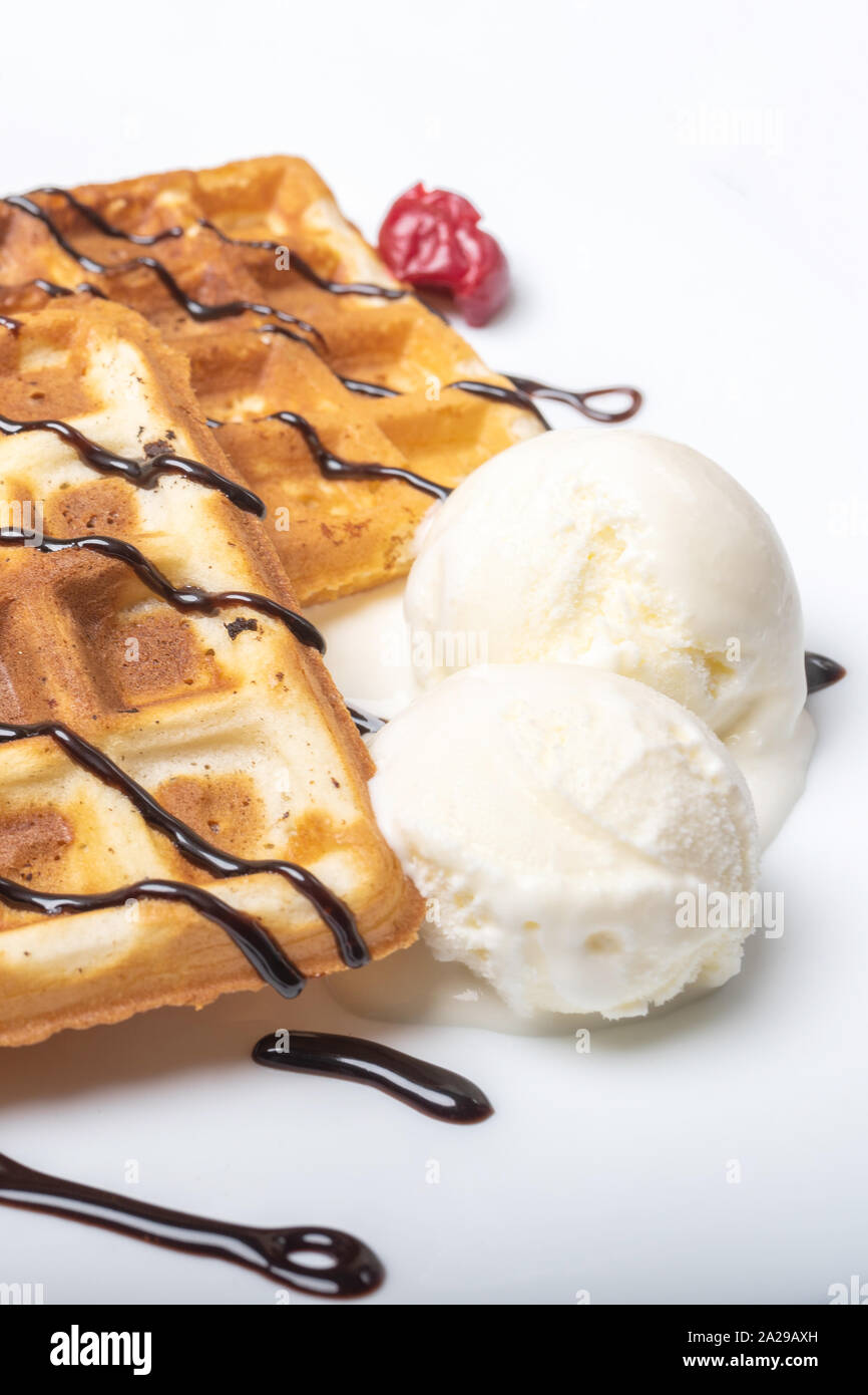 Viennese waffles with ice cream, chocolate and cherry.  Stock Photo