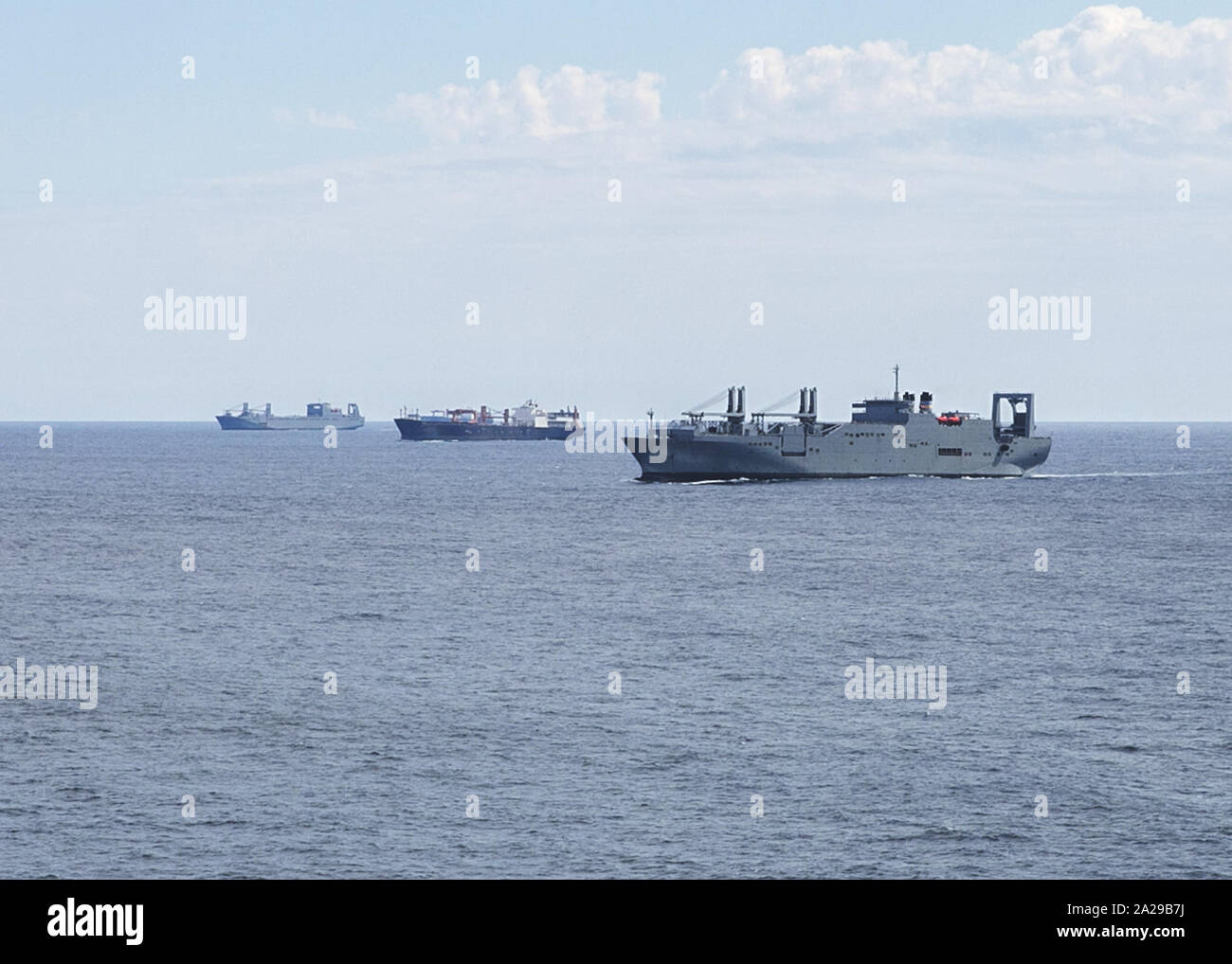 190924-N-BI924-9978  CHESAPEAKE BAY (Sept. 24, 2019) Military Sealift Command, from left to right, large, medium-speed roll-on/roll-off vessel USNS Mendonca (T-AKR 303), container and roll-on/roll-off ship USNS PFC Eugene A. Obregon (T-AK 3006), and large, medium-speed roll-on/roll-off vessel USNS Gilliland (T-AKR 298), participate in a group sail during Turbo Activation. Turbo Activation is a large-scale sealift readiness exercise series, which rapidly activates a mix of Military Sealift Command and U.S. Department of Transportation’s Maritime Administration ships on the East, West, and Gulf Stock Photo