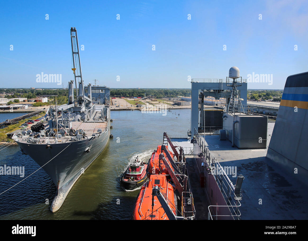190921-N-BI294-9593  NORFOLK (Sept. 21, 2019) Military Sealift Command large, medium-speed roll-on/roll-off (LMSR) vessel USNS Benavidez (T-AKR 306), departs Lambert’s Point Shipyard alongside USNS Mendonca (T-AKR 303) for Turbo Activation. Turbo Activation is a large-scale sealift readiness exercise series, which rapidly activates a mix of Military Sealift Command and U.S. Department of Transportation’s Maritime Administration ships on the East, West, and Gulf Coasts. The exercise provides an assessment of the readiness of U.S. sealift forces, while also stressing the underlying support netwo Stock Photo