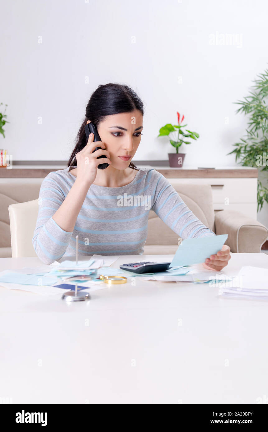 The young woman in budget planning concept Stock Photo