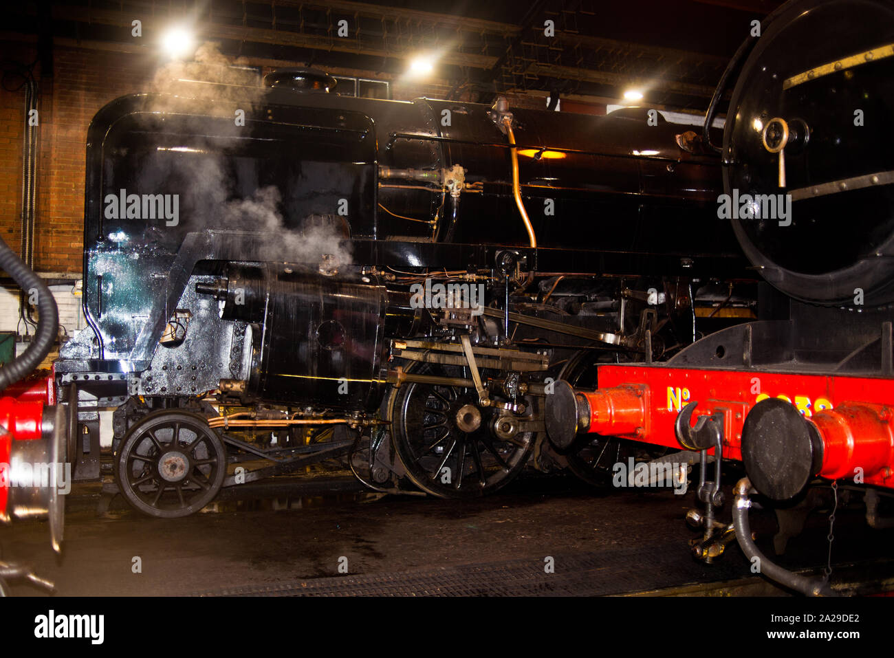 9F No 92134 Steam Locomotive inside Grosmont Motive Power Depot, North Yorkshire Moors Railway, England Stock Photo
