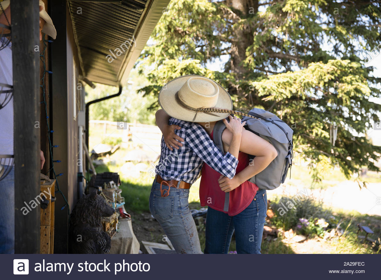 Daughter arriving home to ranch and hugging mother Stock Photo Alamy