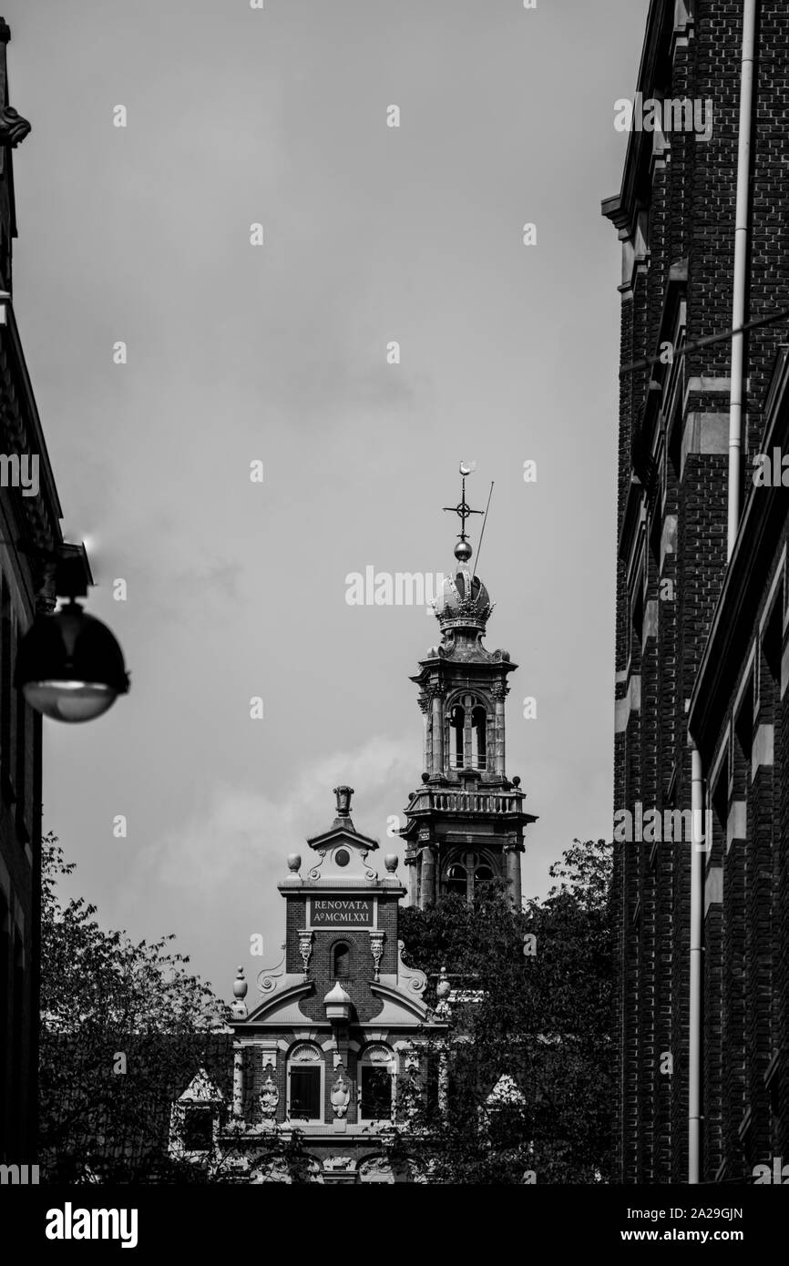 Brick and stone facades of old church towers in black and white Stock ...